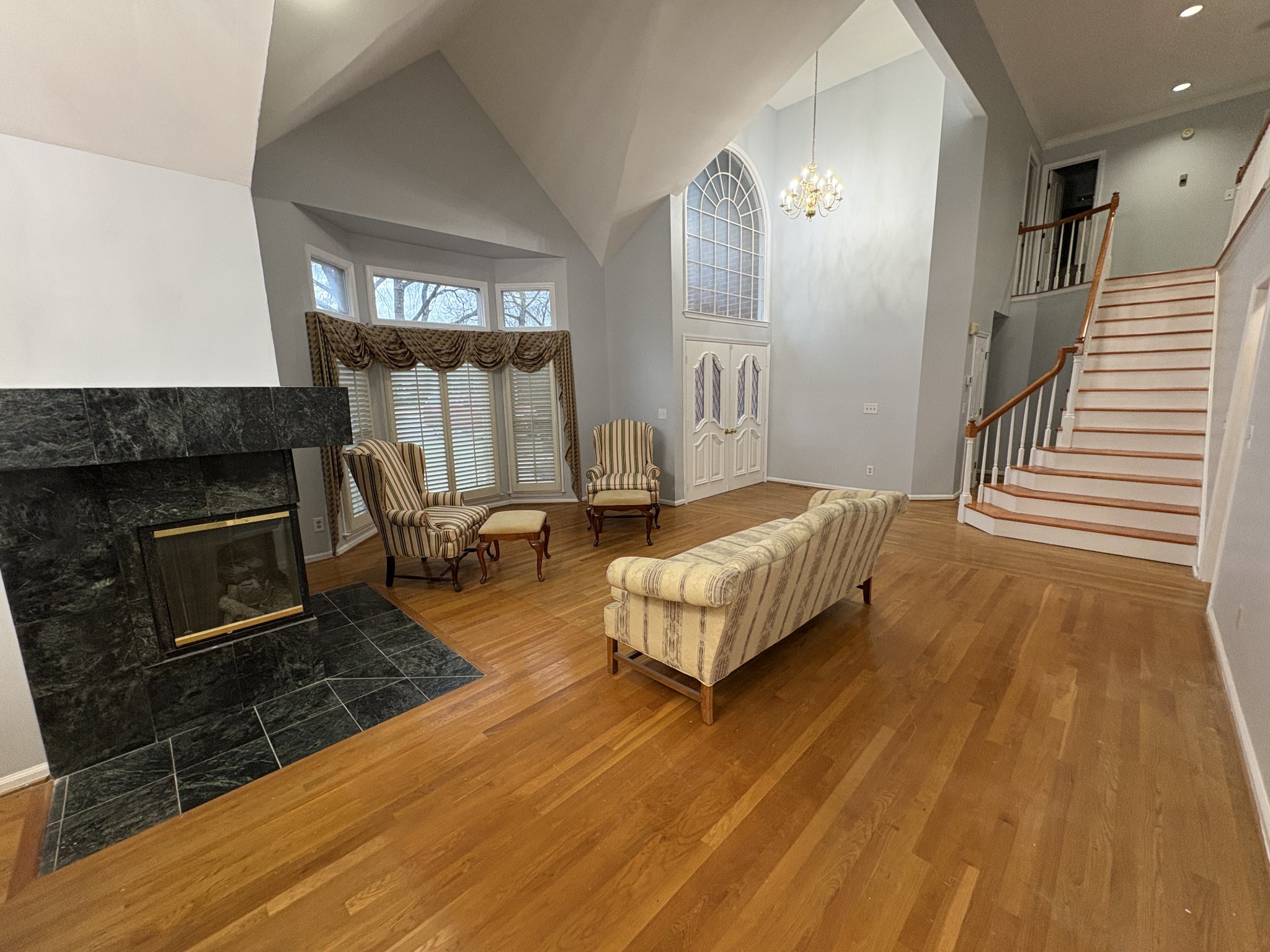 903 Jennifer Court Murfreesboro, TN 37129 - Photo 5 of 32 a spacious bedroom with a bed a fireplace and windows