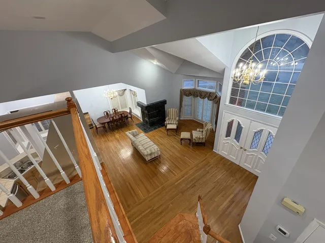 a view of living room with furniture and chandelier