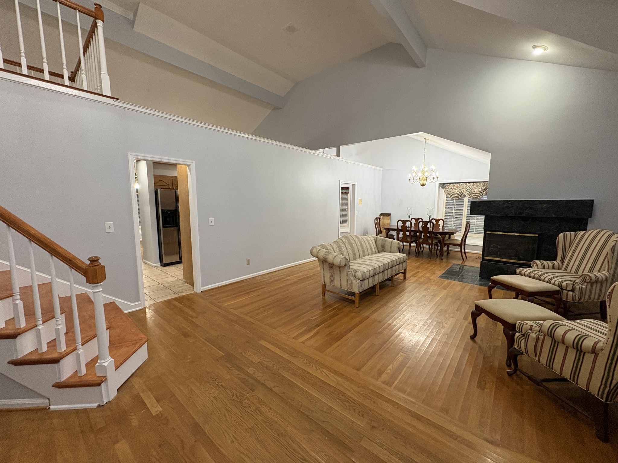 903 Jennifer Court Murfreesboro, TN 37129 - Photo 8 of 32 a living room with furniture and a chandelier