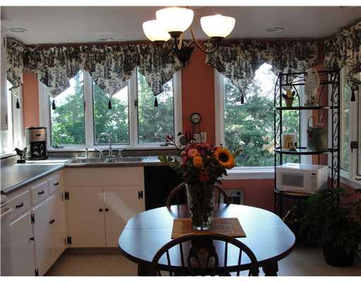 1203 Prospect Road Whitehall, PA 15227 - Photo 4 of 18 Kitchen. eat in kitchen vinyl flooring counter tops smooth surface stove/oven water faucets 2005 dishwsher new in wall electric heater 2007 new chandeleir 2006 plenty of natural light marble window sills window treatments may remain