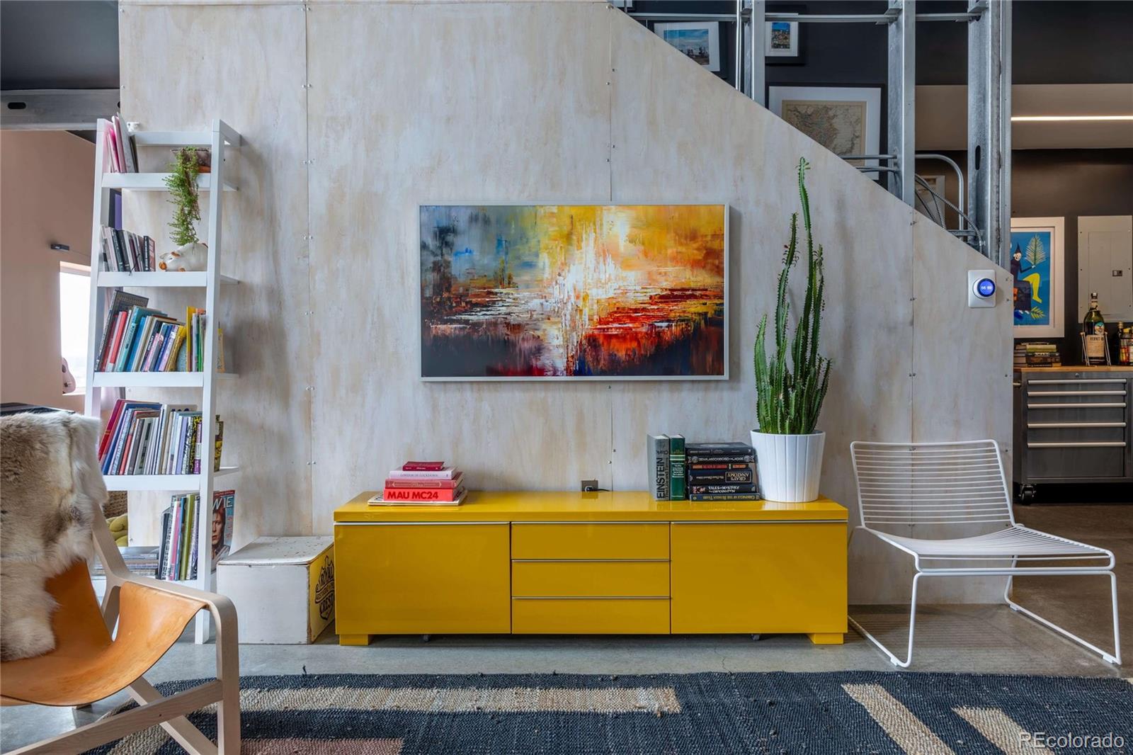 a room with furniture pool table and a flat screen tv