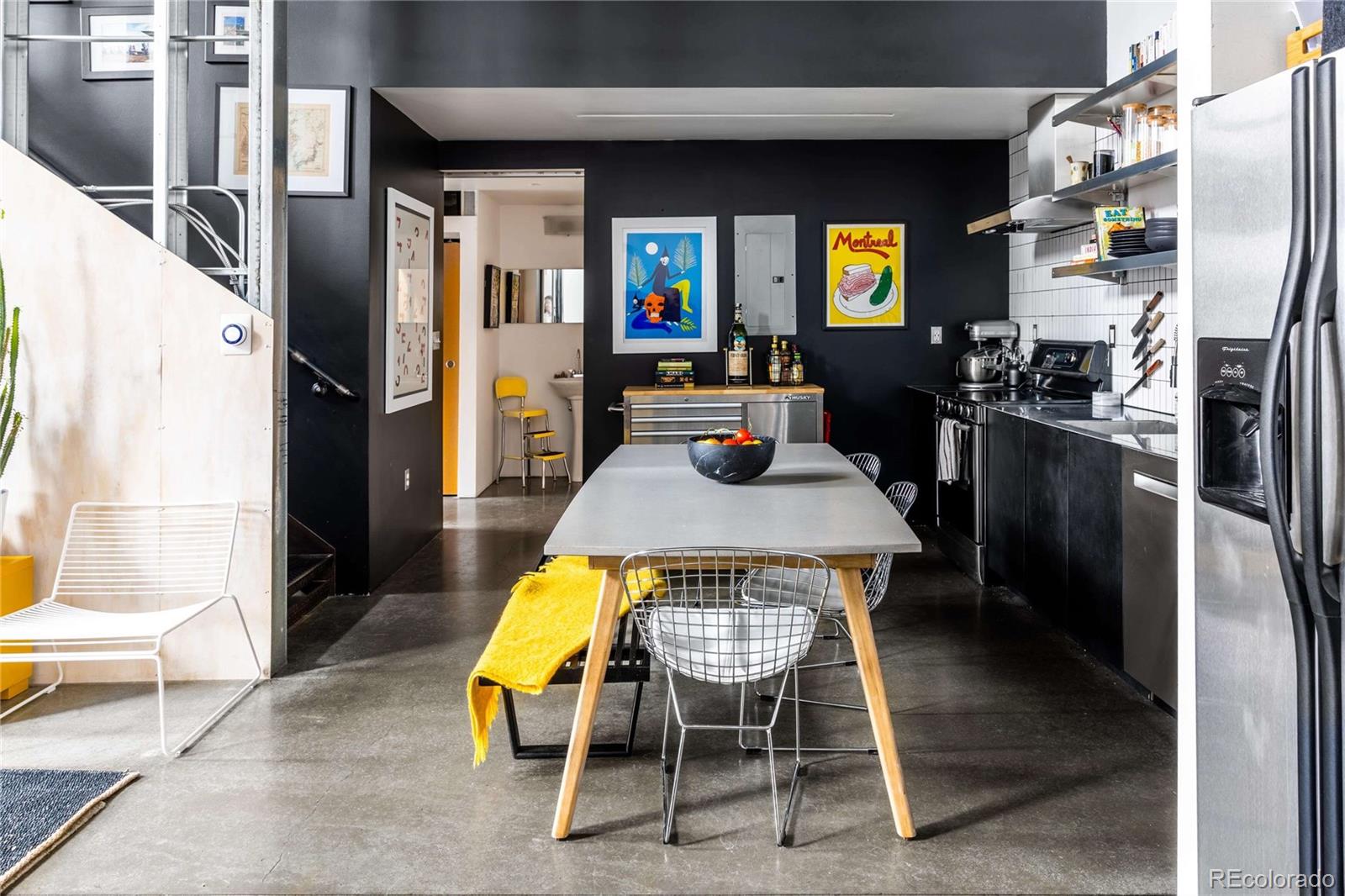 3457 Ringsby Court, Unit 306 Denver, CO 80216 - Photo 14 of 38 a view of kitchen with furniture and a refrigerator