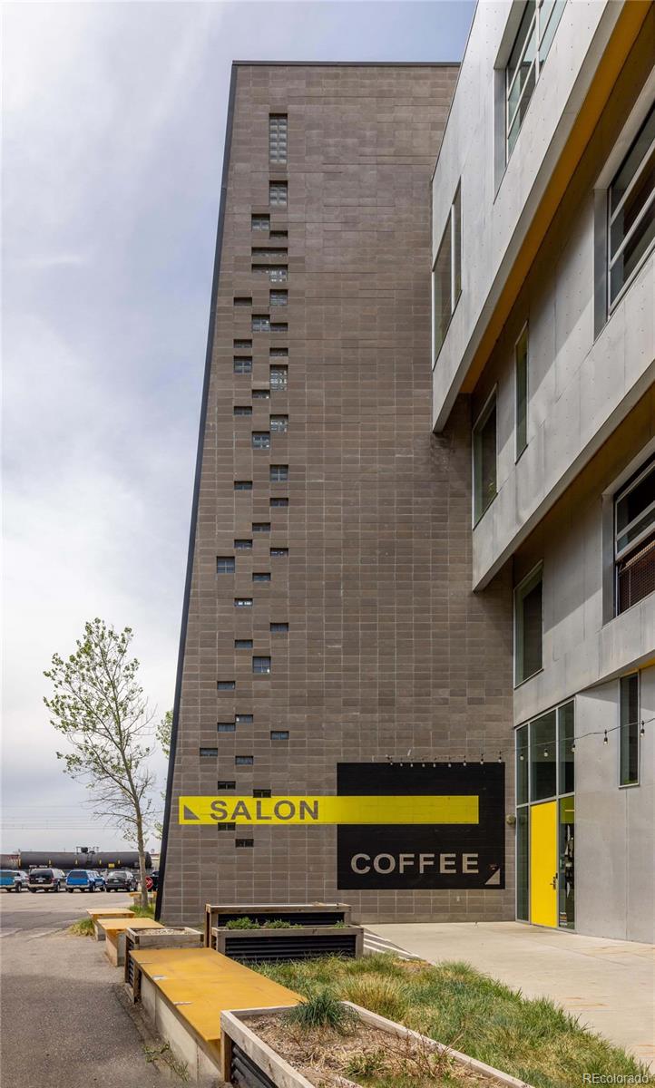 3457 Ringsby Court, Unit 306 Denver, CO 80216 - Photo 37 of 38 a view of a swimming pool with outdoor seating
