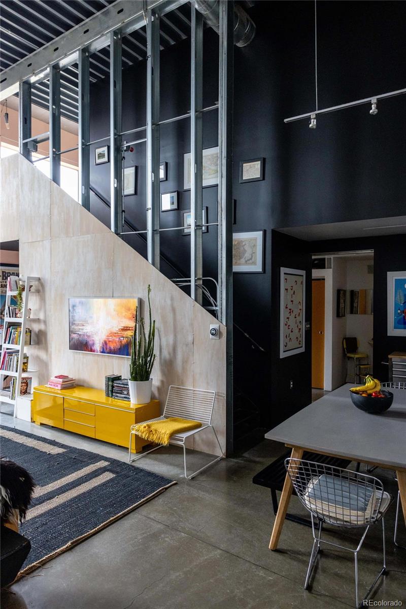 3457 Ringsby Court, Unit 306 Denver, CO 80216 - Photo 4 of 38 a view of backyard of a house with barbeque oven table and chairs