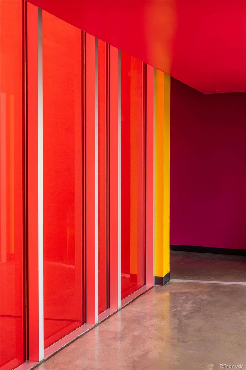 3457 Ringsby Court, Unit 306 Denver, CO 80216 - Photo 8 of 38 a view of a room with wooden wall and a large window