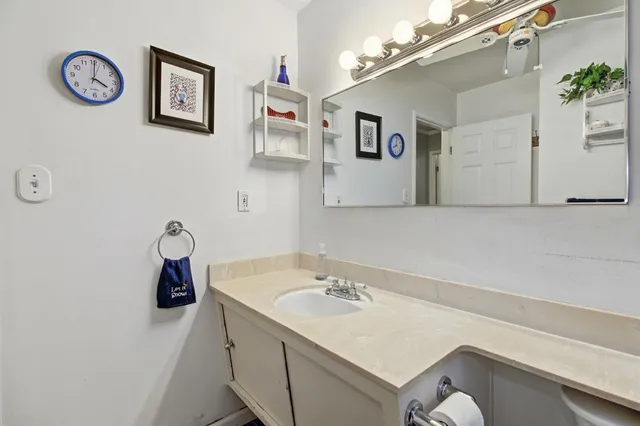 a bathroom with a sink and mirror