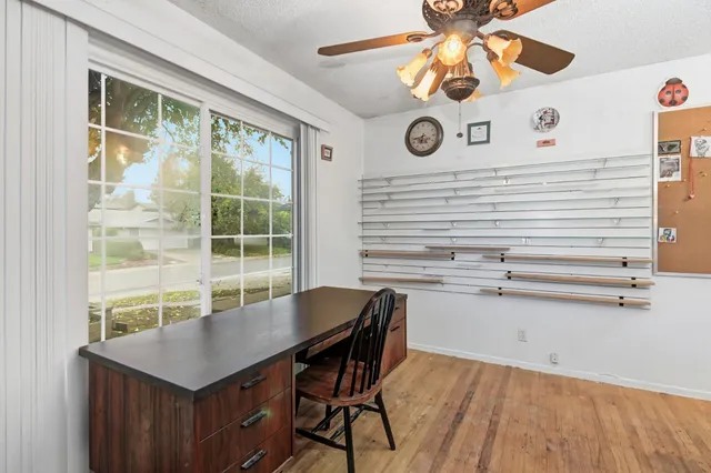 a view of a dining room with furniture and window