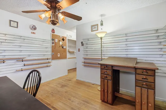 a view of a hallway with entryway and chandelier