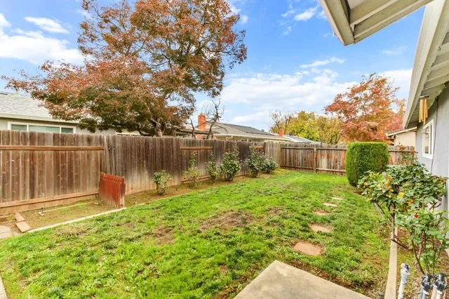 a backyard of a house with lots of green space