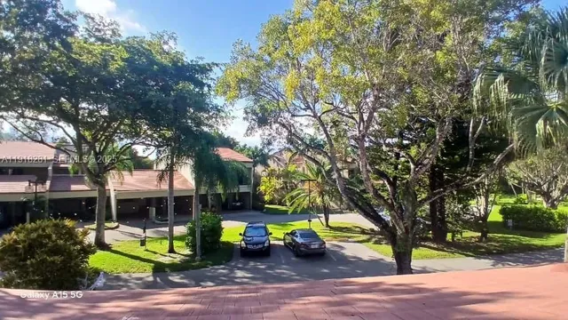 a view of yard with swimming pool and sitting area