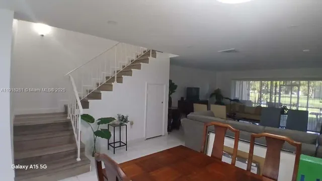 a kitchen with a sink stainless steel appliances and cabinets