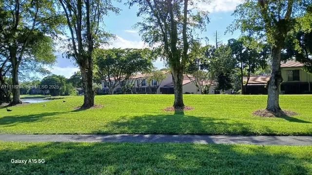 a view of a park with tree s