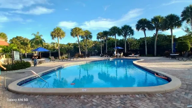 a bathroom with a glass shower door and a glass door