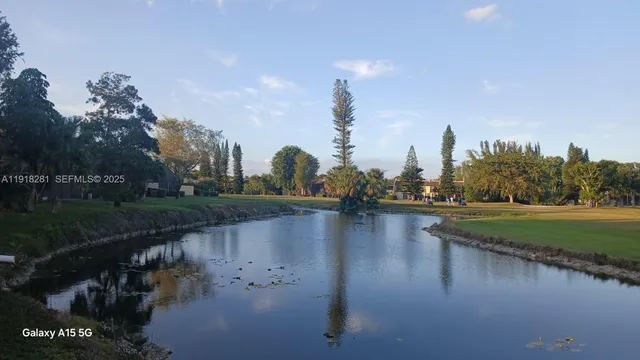 a view of a golf course with a big yard