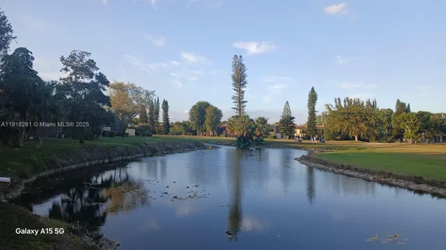 a view of a golf course with a big yard