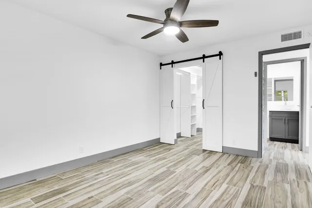 a view of an empty room with a window