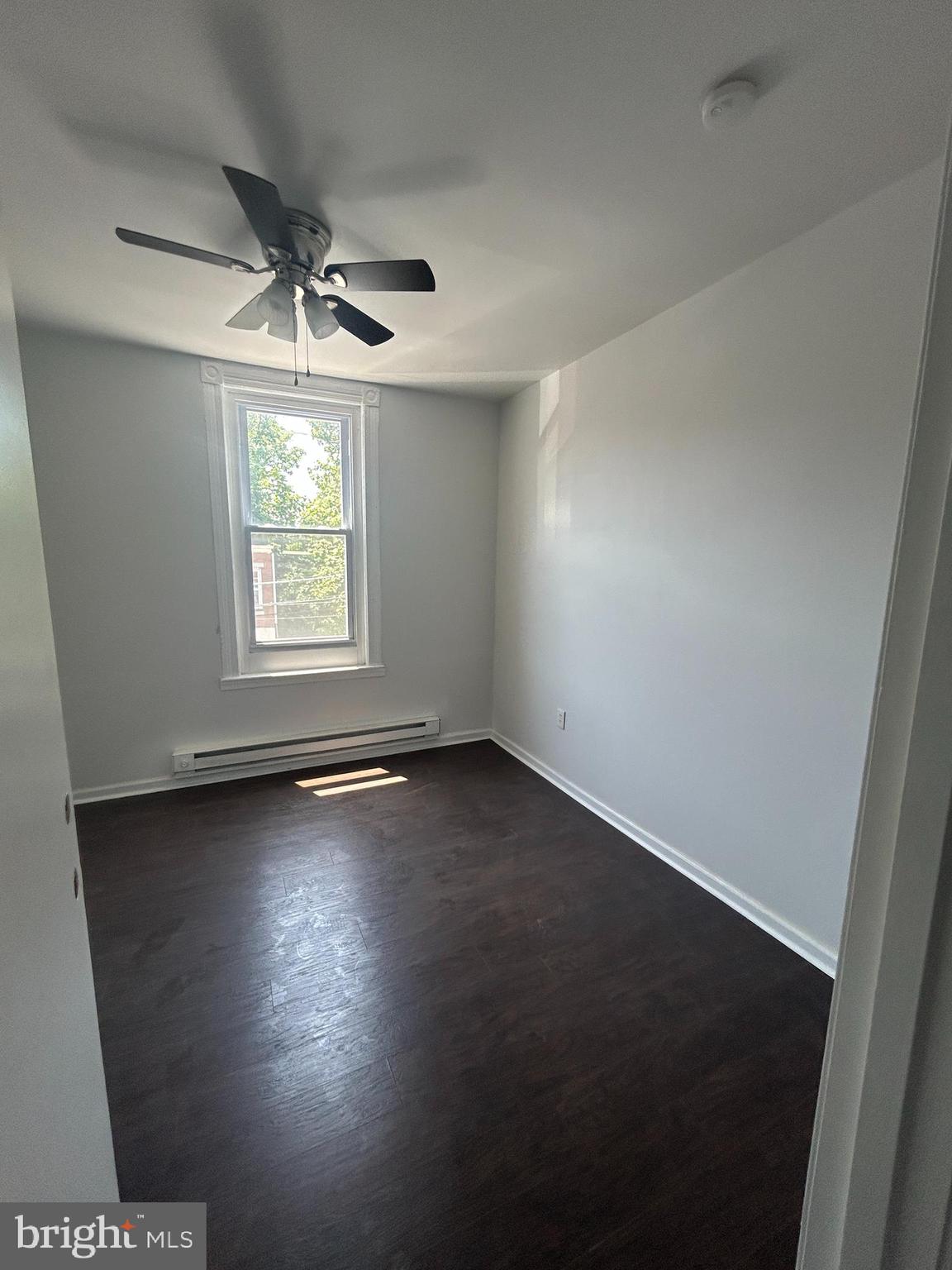 4100 Old York Road Philadelphia, PA 19140 - Photo 21 of 30 an empty room with wooden floor and windows