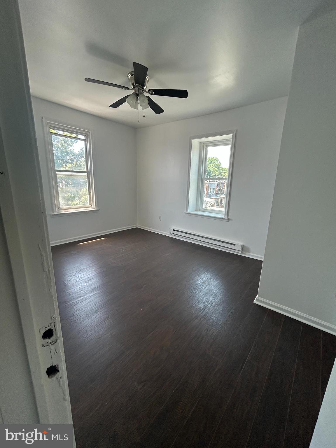 4100 Old York Road Philadelphia, PA 19140 - Photo 22 of 30 an empty room with wooden floor and windows