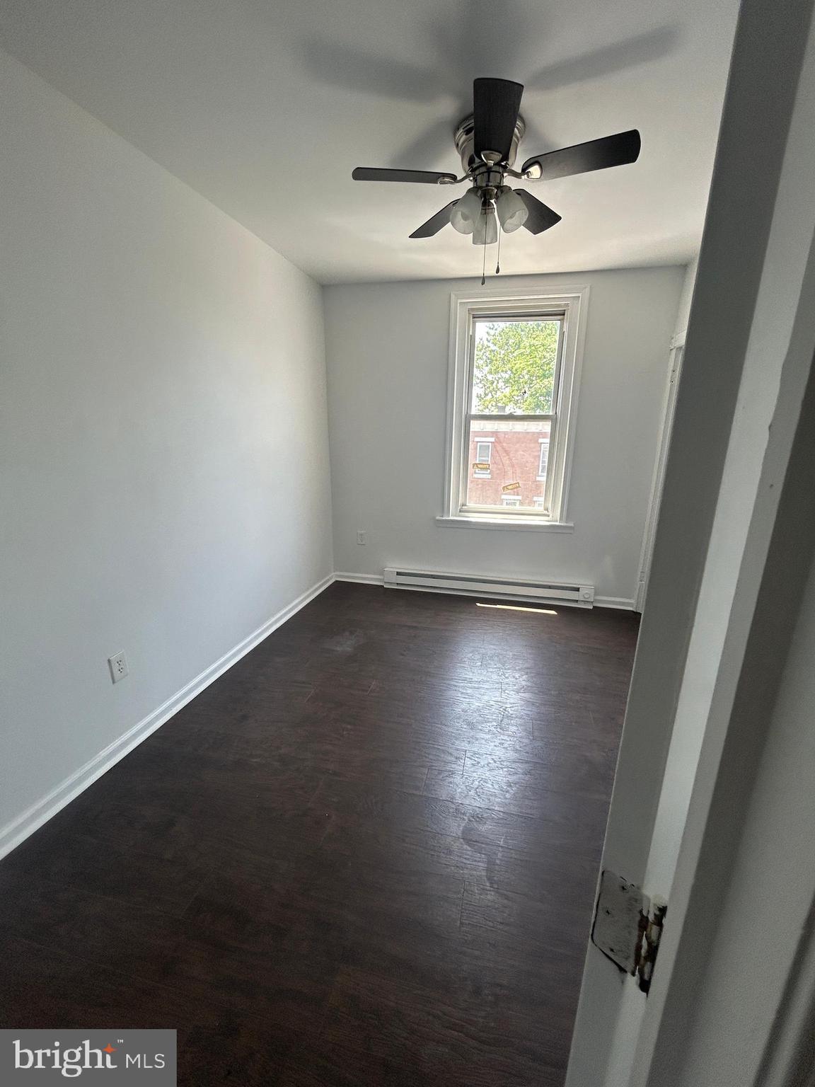 4100 Old York Road Philadelphia, PA 19140 - Photo 23 of 30 an empty room with wooden floor and windows