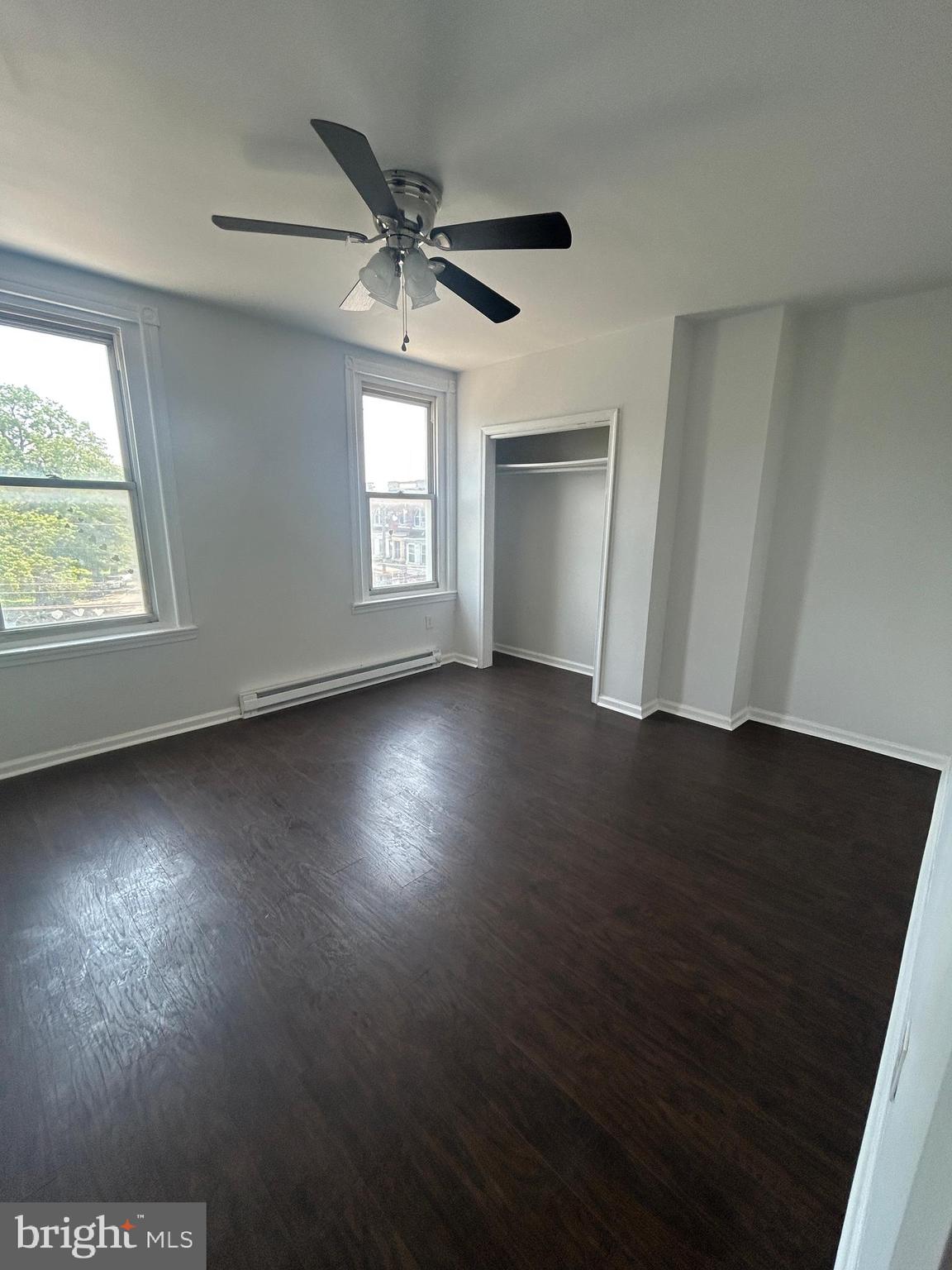 4100 Old York Road Philadelphia, PA 19140 - Photo 25 of 30 an empty room with wooden floor fan and windows