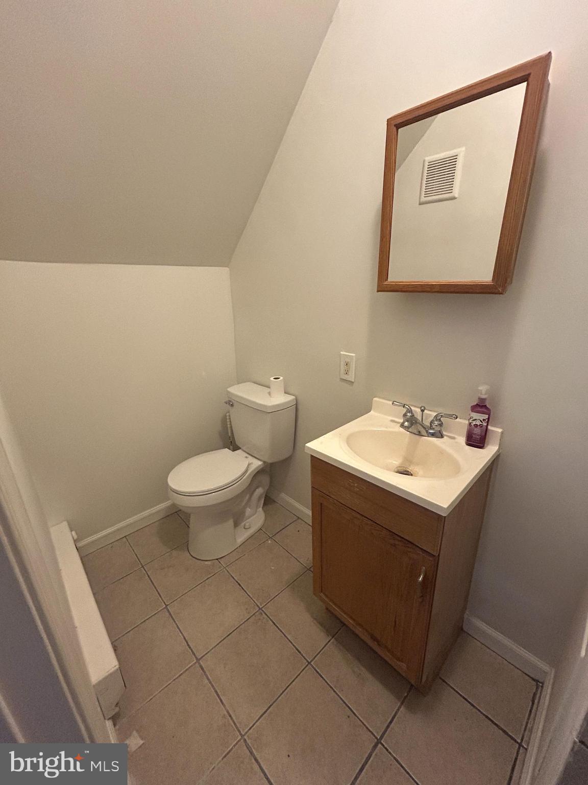4100 Old York Road Philadelphia, PA 19140 - Photo 26 of 30 a utility room with a sink a toilet and mirror