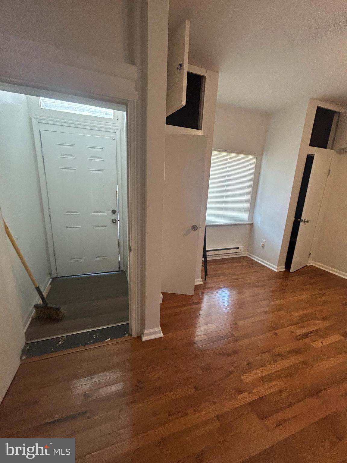 4100 Old York Road Philadelphia, PA 19140 - Photo 3 of 30 an empty room with wooden floor and entrance