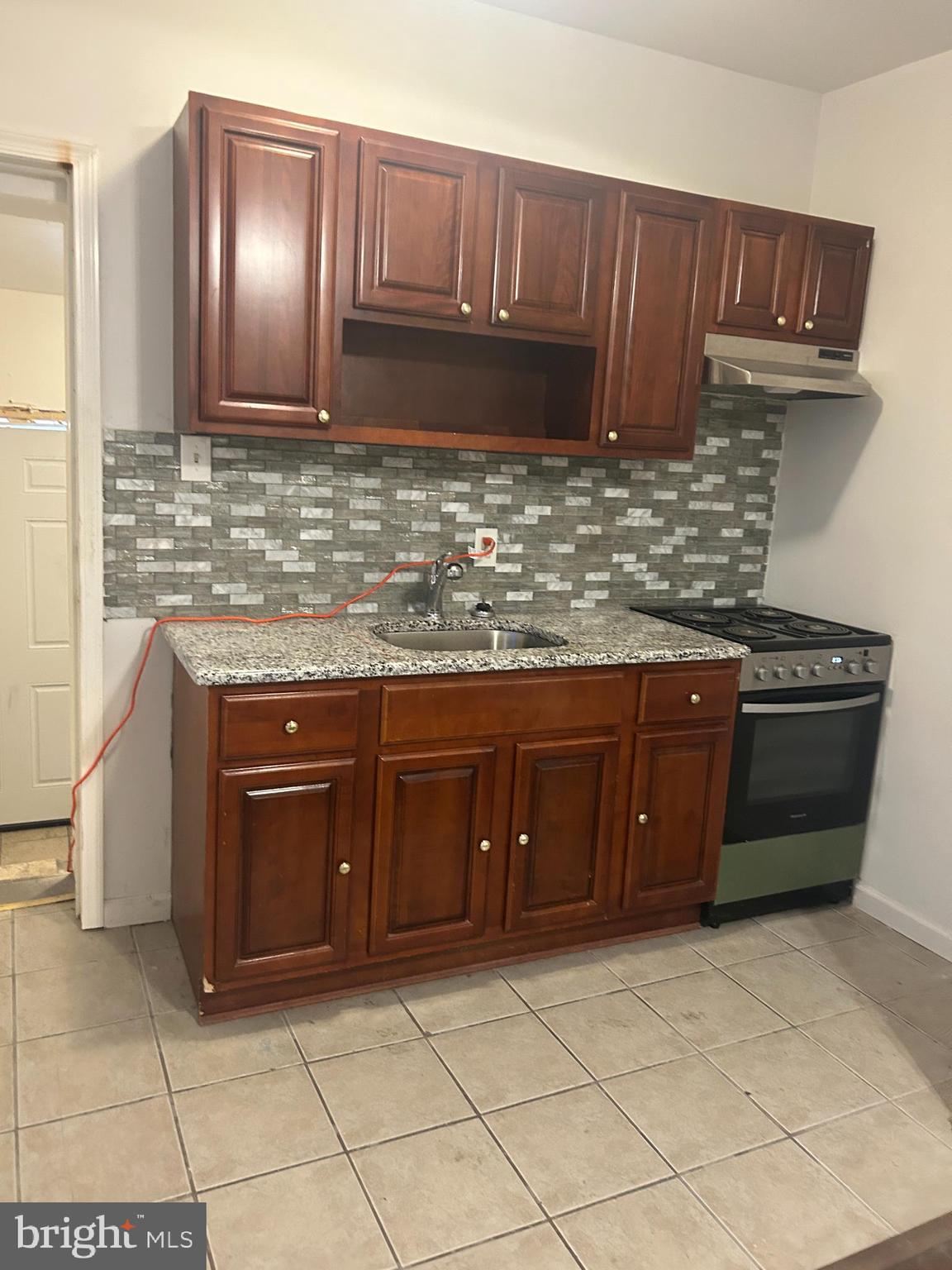 4100 Old York Road Philadelphia, PA 19140 - Photo 10 of 30 a kitchen with a sink and cabinets