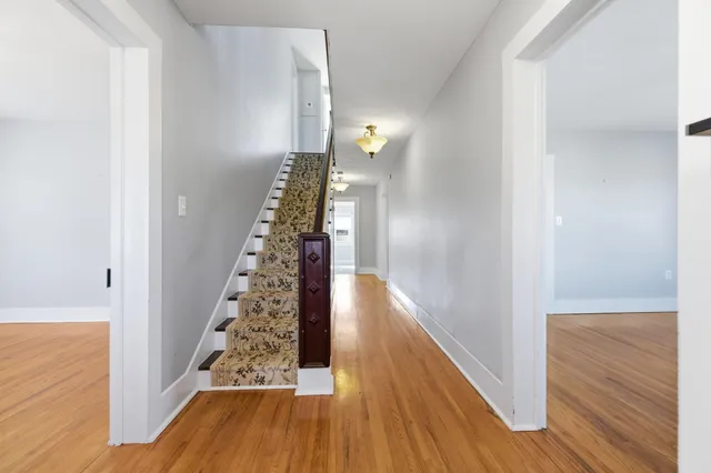 a view of a livingroom with a ceiling fan and window