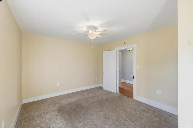 a bathroom with a sink toilet and a mirror