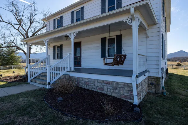a view of a swimming pool with mountains in the background