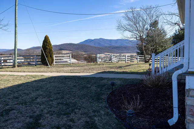 a view of a terrace with a table and chairs