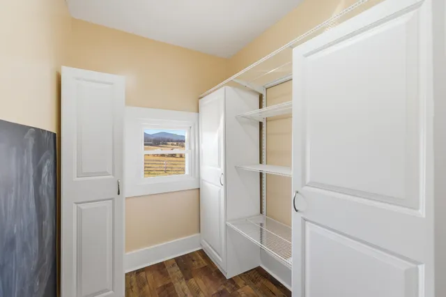 a kitchen with wooden cabinets and a stove top oven