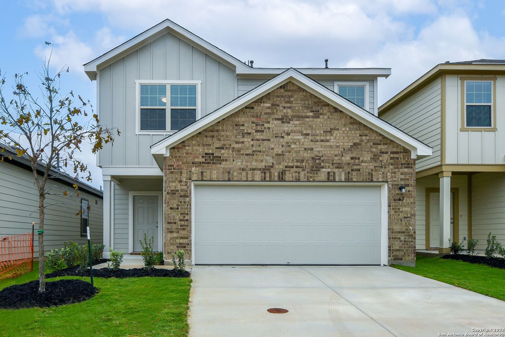 a front view of house with garden