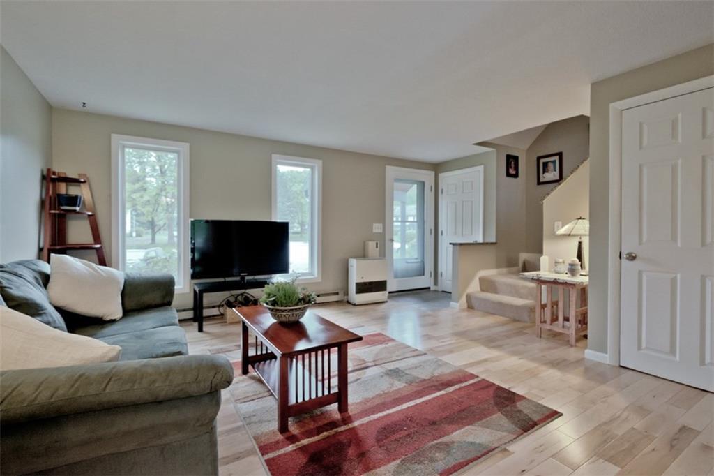 Living room has large windows for...