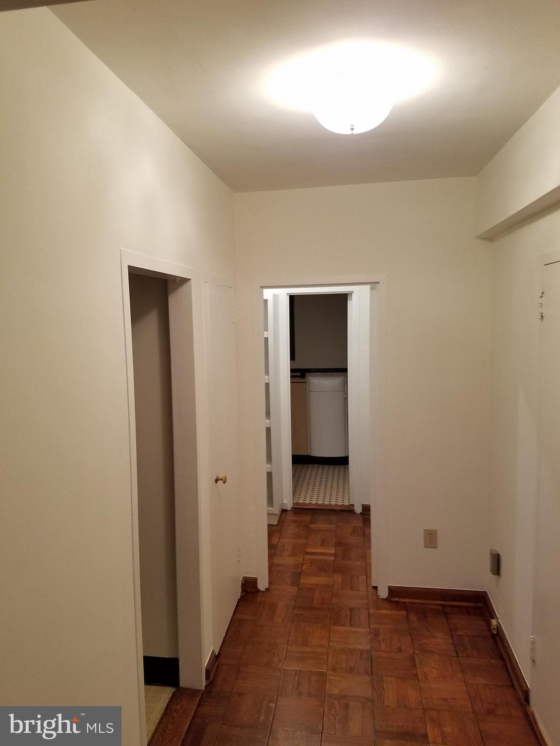 1 Scott Circle Northwest, Unit 102 Washington, DC 20005 - Photo 16 of 17 a view of a hallway with wooden floor