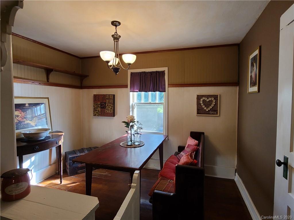 26 Jones Road Leicester, NC 28748 - Photo 12 of 34 a view of a dining room with furniture and wooden floor