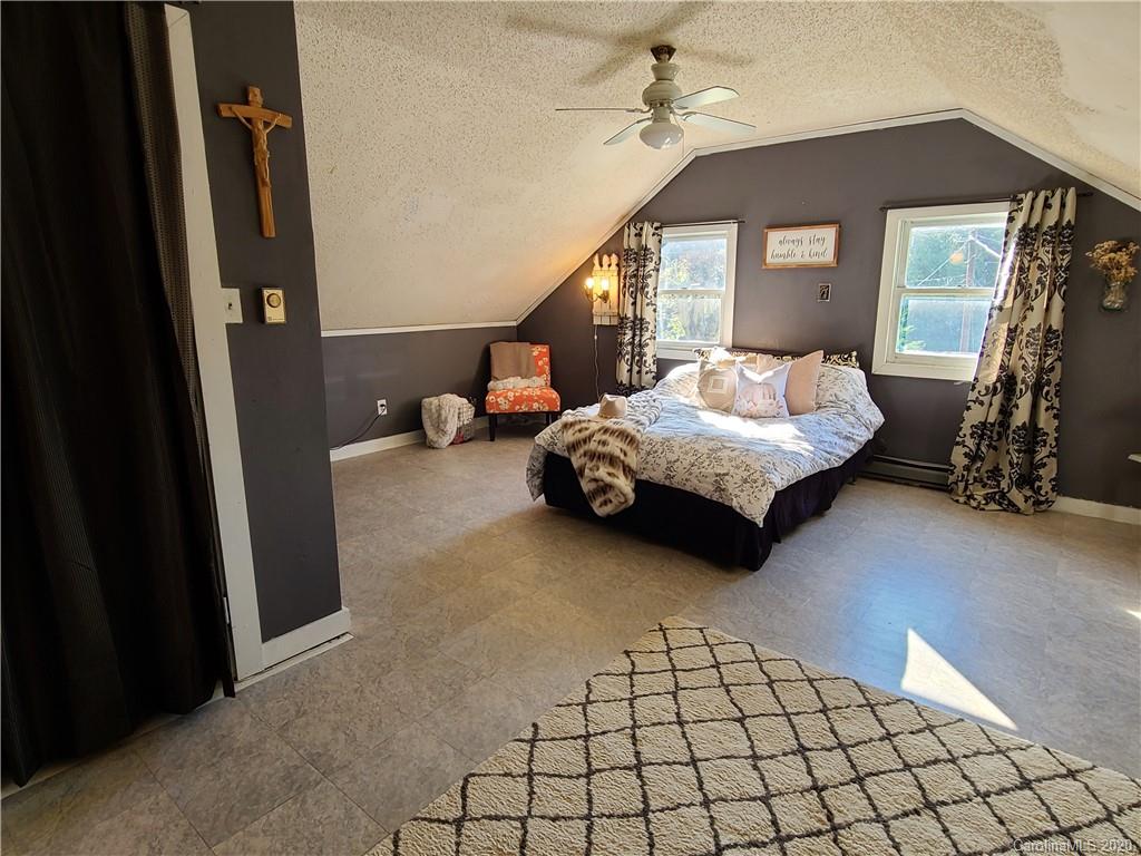 26 Jones Road Leicester, NC 28748 - Photo 25 of 34 a bedroom with furniture and window