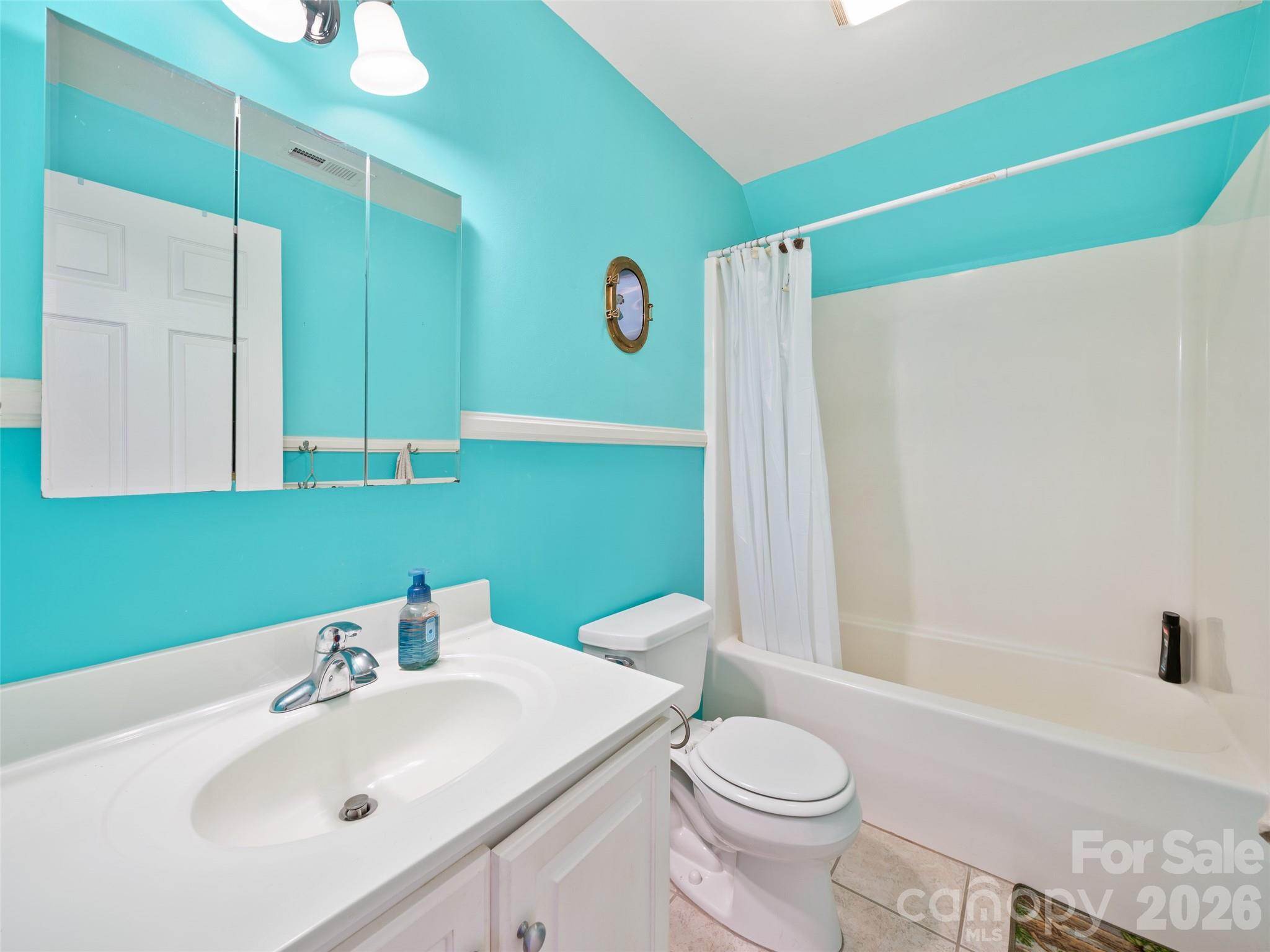 2216 Beans Creek Road Bakersville, NC 28705 - Photo 22 of 39 a bathroom with a sink a toilet and shower