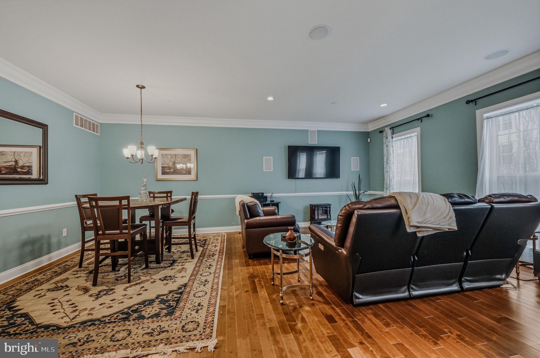 208 Jackdaw Alley, Unit 208 Springfield, PA 19064 - Photo 18 of 43 a living room with furniture and a wooden floor