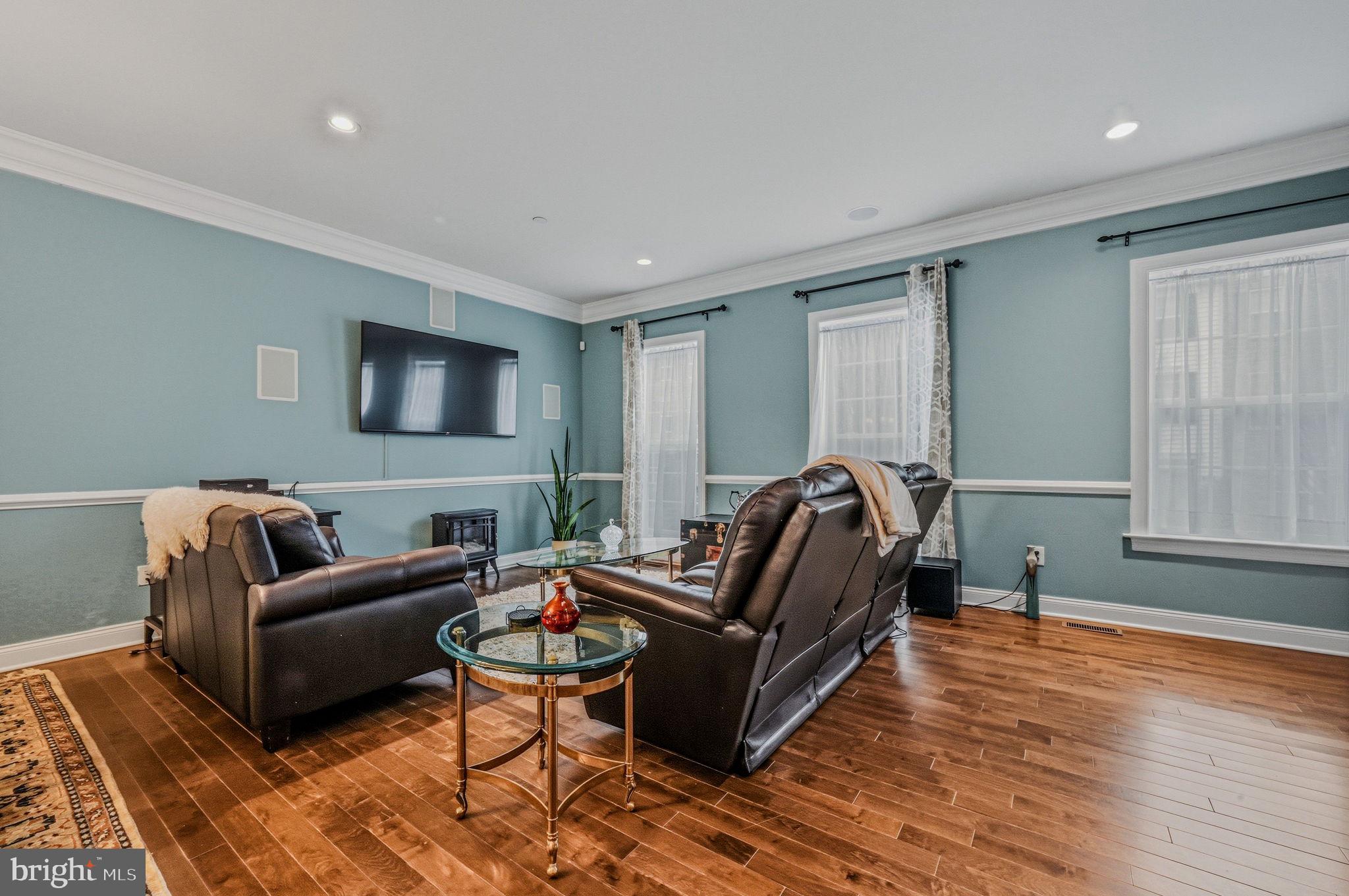 208 Jackdaw Alley, Unit 208 Springfield, PA 19064 - Photo 21 of 43 a living room with furniture and a flat screen tv