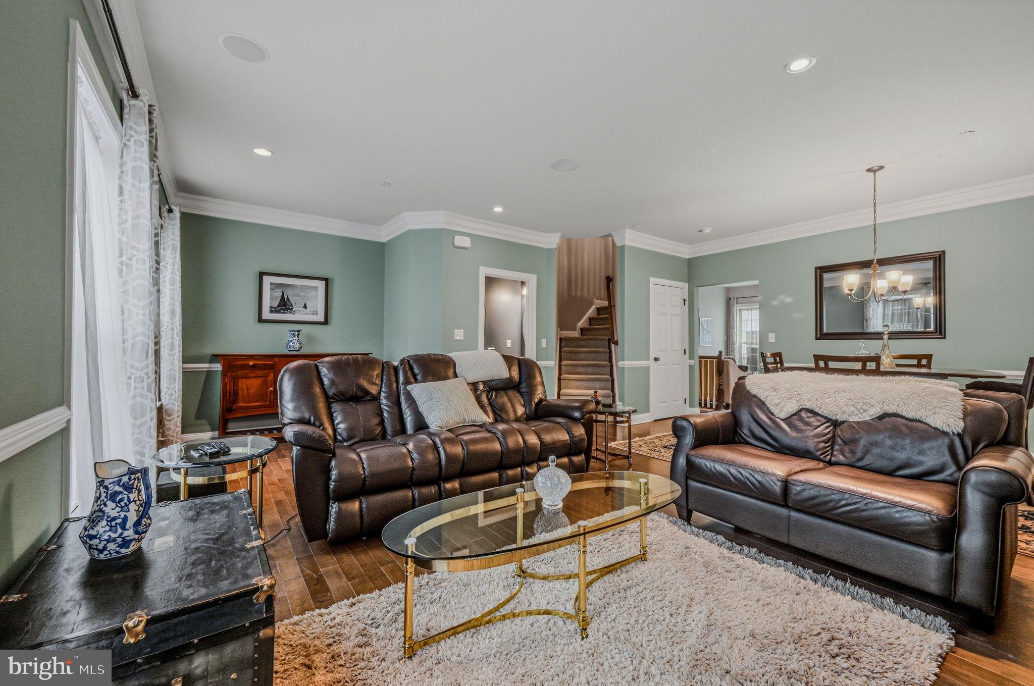 208 Jackdaw Alley, Unit 208 Springfield, PA 19064 - Photo 22 of 43 a living room with furniture or couch and a flat screen tv