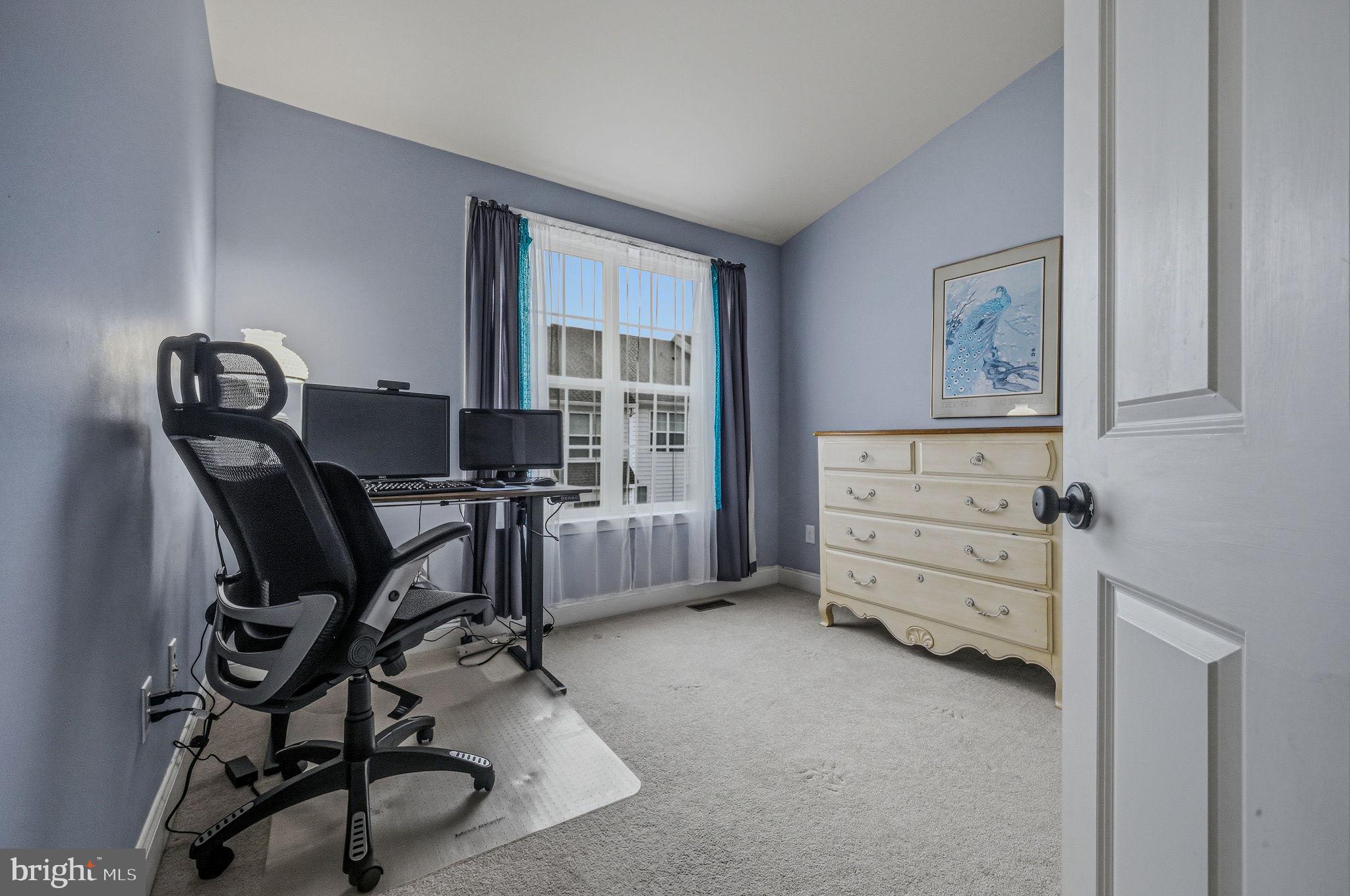 208 Jackdaw Alley, Unit 208 Springfield, PA 19064 - Photo 23 of 41 a view of a workspace with furniture and gym equipment