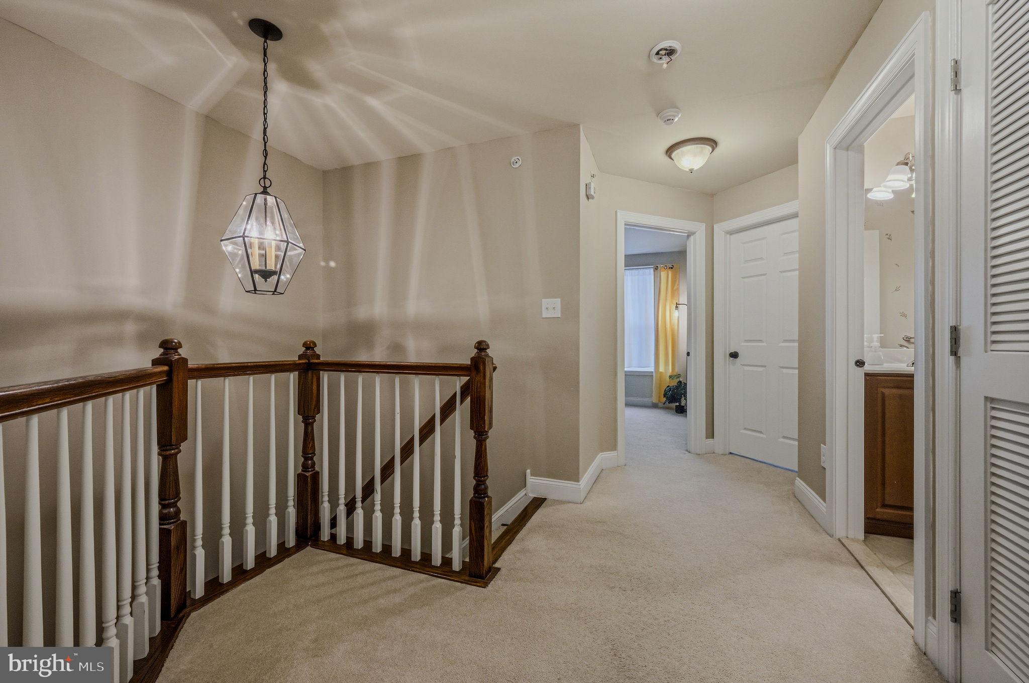 208 Jackdaw Alley, Unit 208 Springfield, PA 19064 - Photo 23 of 43 a view of a hallway to rooms