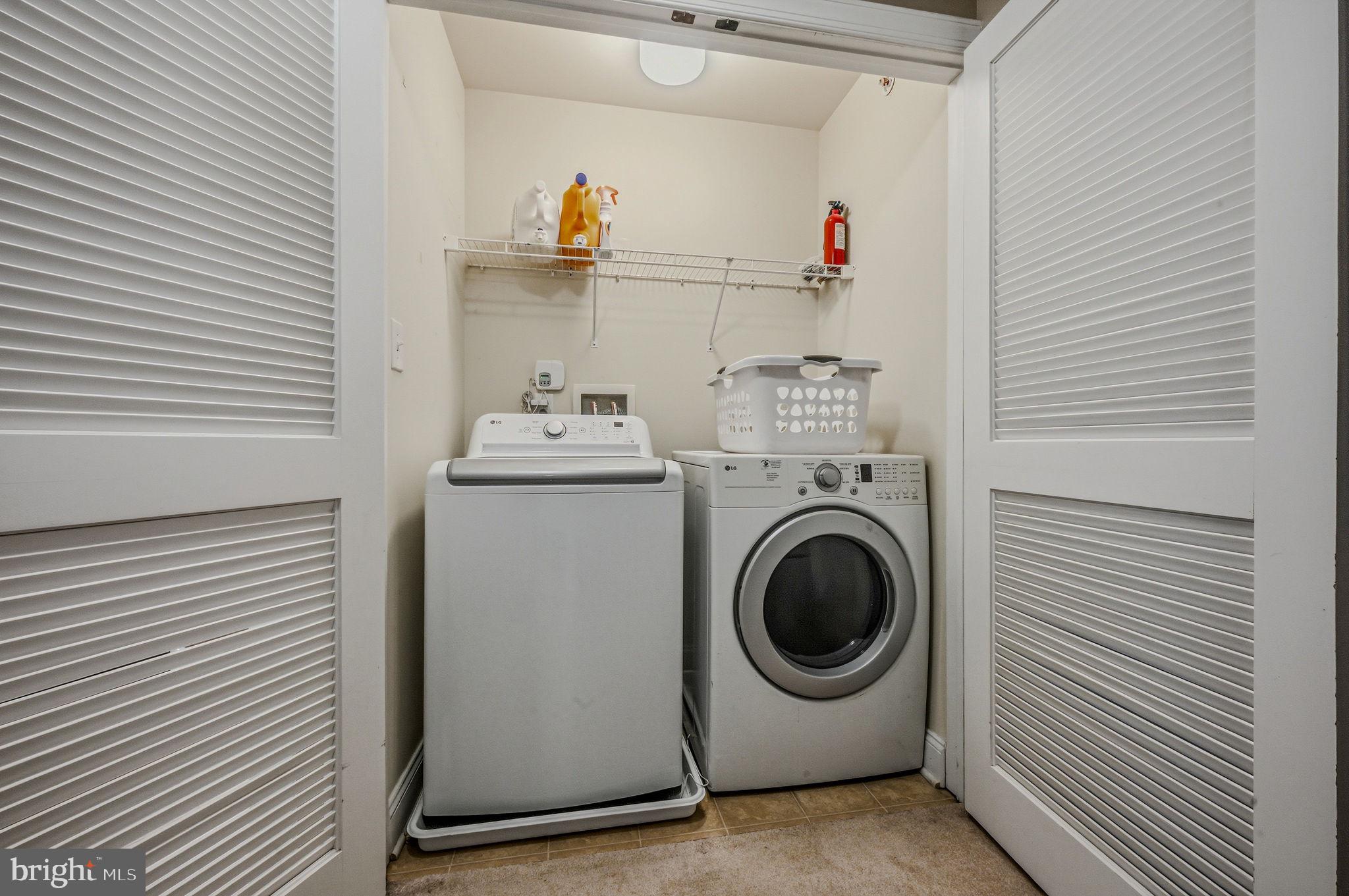 208 Jackdaw Alley, Unit 208 Springfield, PA 19064 - Photo 33 of 43 a utility room with dryer and washer