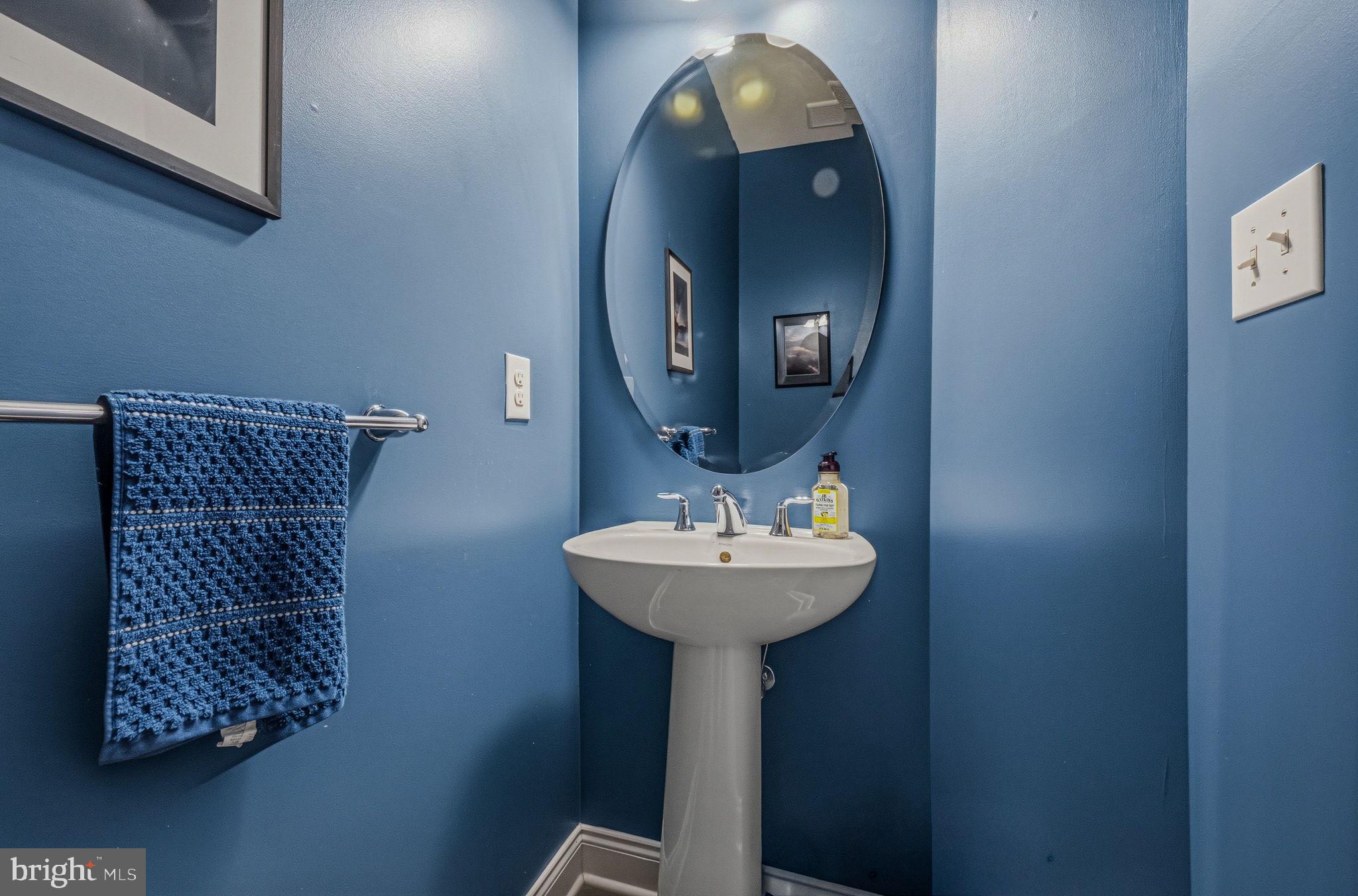 208 Jackdaw Alley, Unit 208 Springfield, PA 19064 - Photo 36 of 43 a bathroom with a sink and a mirror