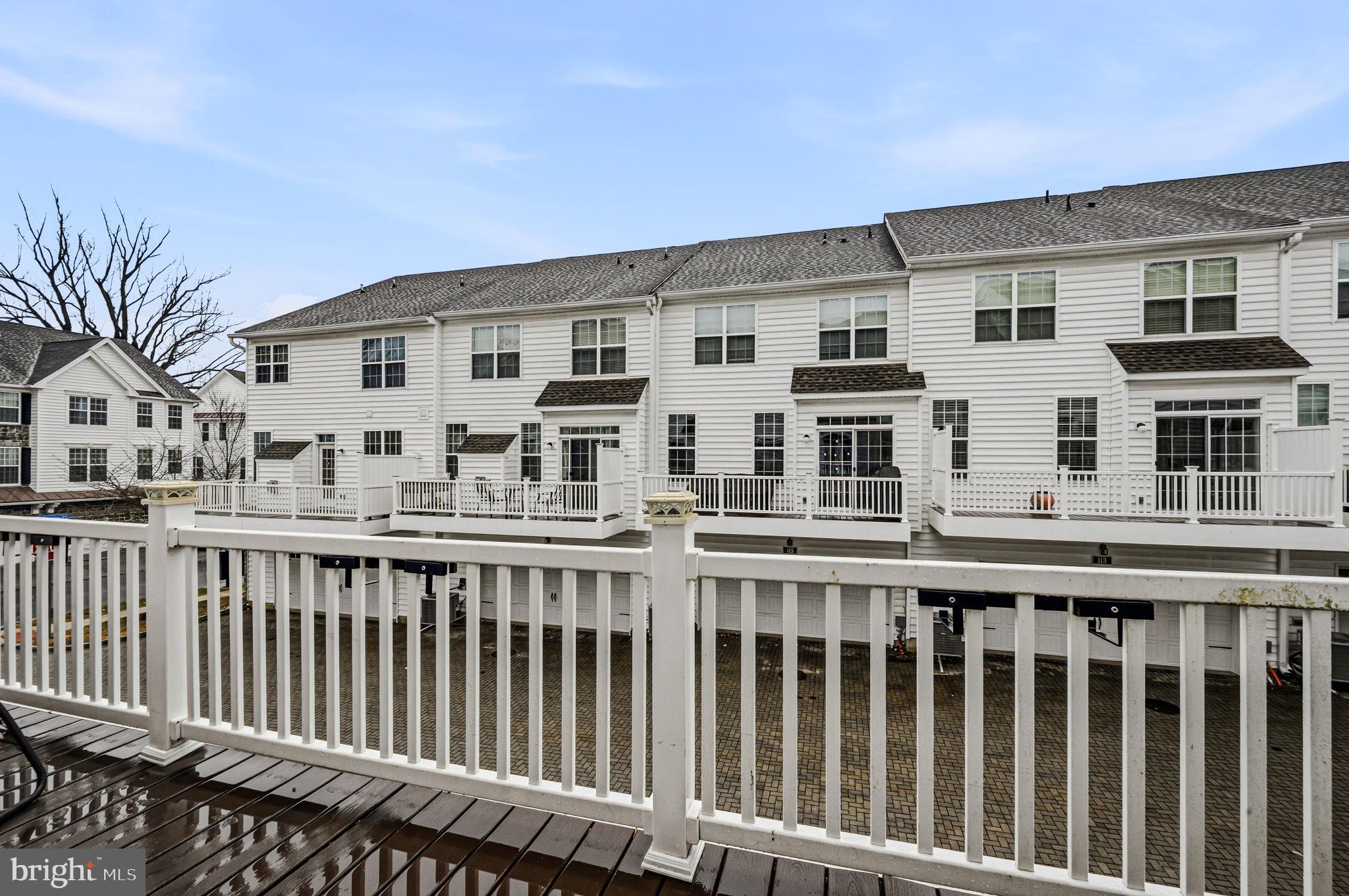 208 Jackdaw Alley, Unit 208 Springfield, PA 19064 - Photo 37 of 43 a view of a building with a wooden fence