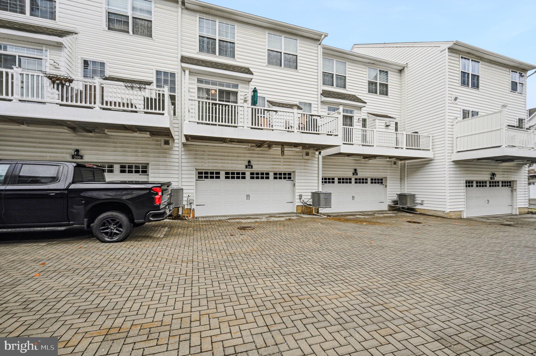 208 Jackdaw Alley, Unit 208 Springfield, PA 19064 - Photo 38 of 43 a car parked in front of a building