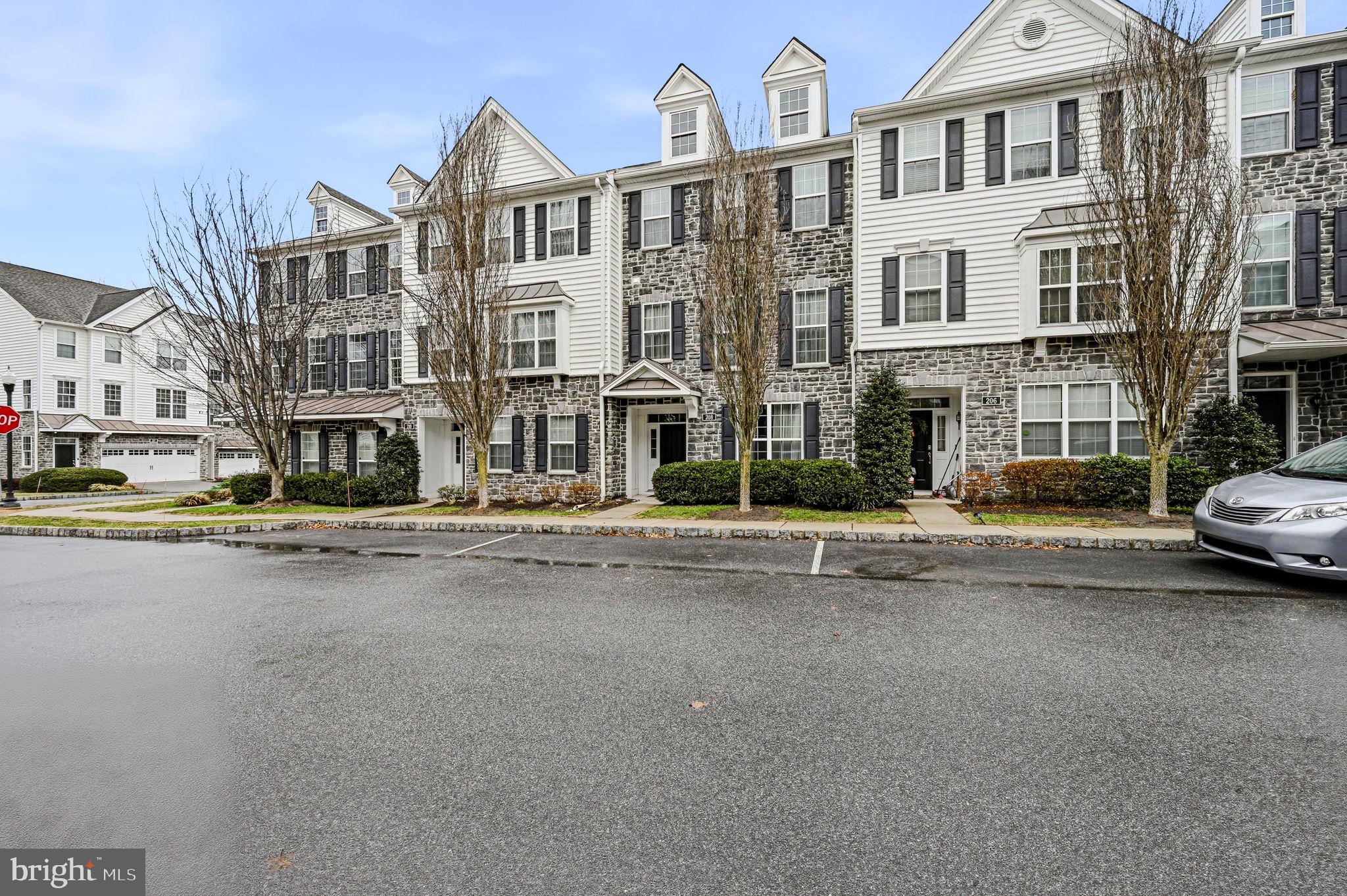 208 Jackdaw Alley, Unit 208 Springfield, PA 19064 - Photo 4 of 43 a view of a street that has couple of cars parked on the road