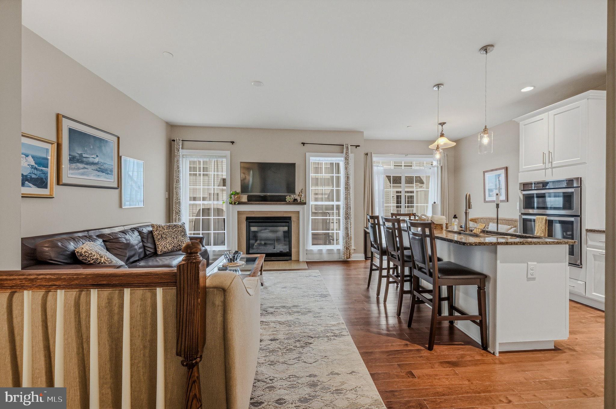 208 Jackdaw Alley, Unit 208 Springfield, PA 19064 - Photo 9 of 43 a living room with furniture a fireplace and a flat screen tv