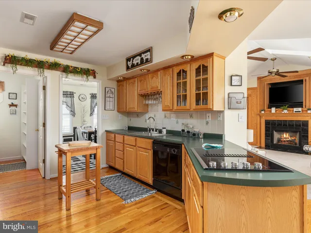 a view of living room with furniture and wooden floor